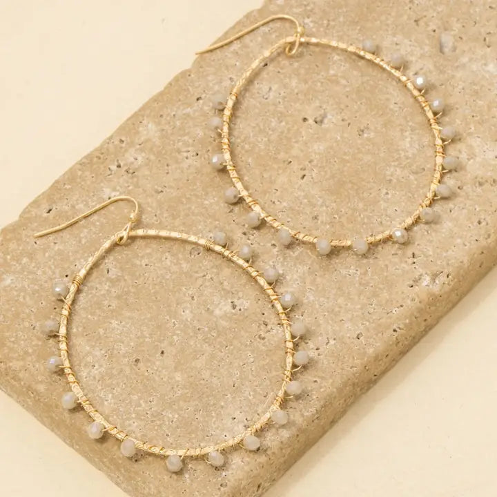 The Faceted Glass Beaded Oval Dangle Earrings
