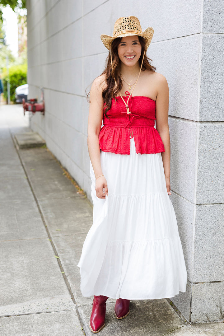 The Strapless Smocked Peplum Hem Top