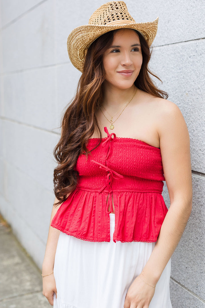 The Strapless Smocked Peplum Hem Top