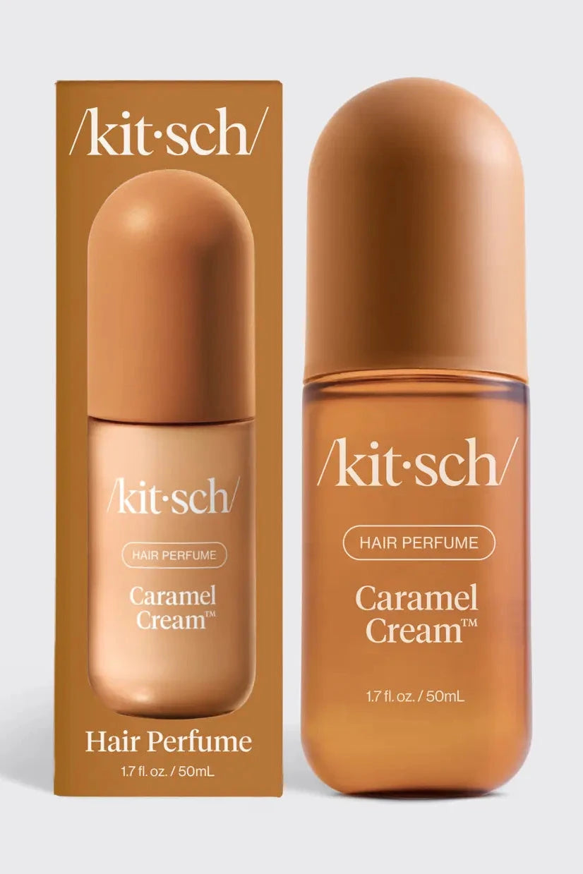 Kit-sch Caramel Cream Hair Perfume bottle and its matching brown cardboard packaging box, displayed side-by-side on a light gray background.
