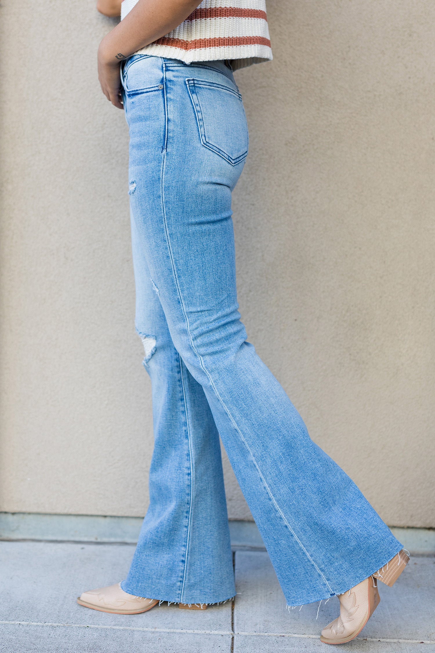 The Milly Medium Light Mid Rise Distressed 33 Inseam Flare