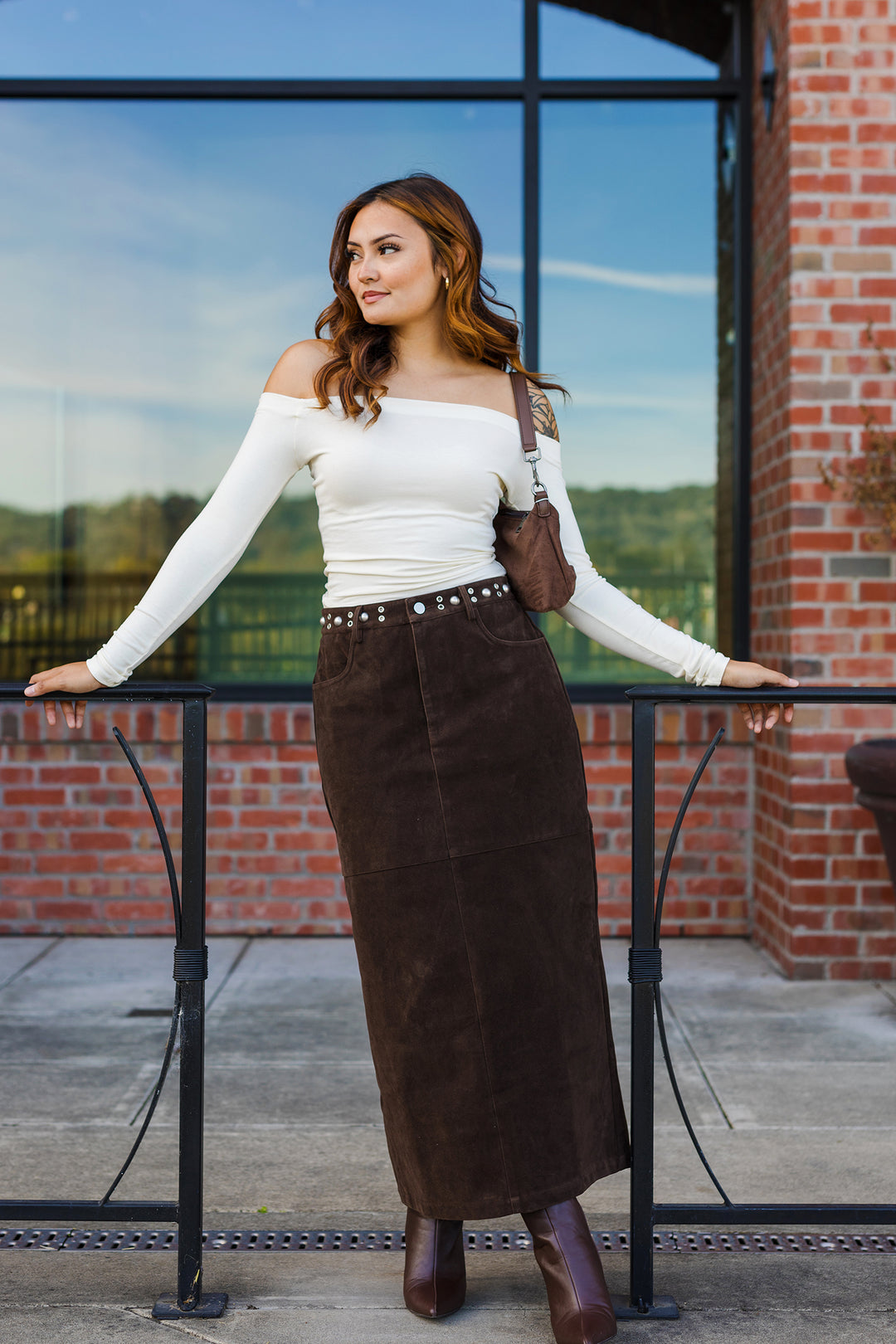 The Tell Me About It Stud Suede Midi Skirt