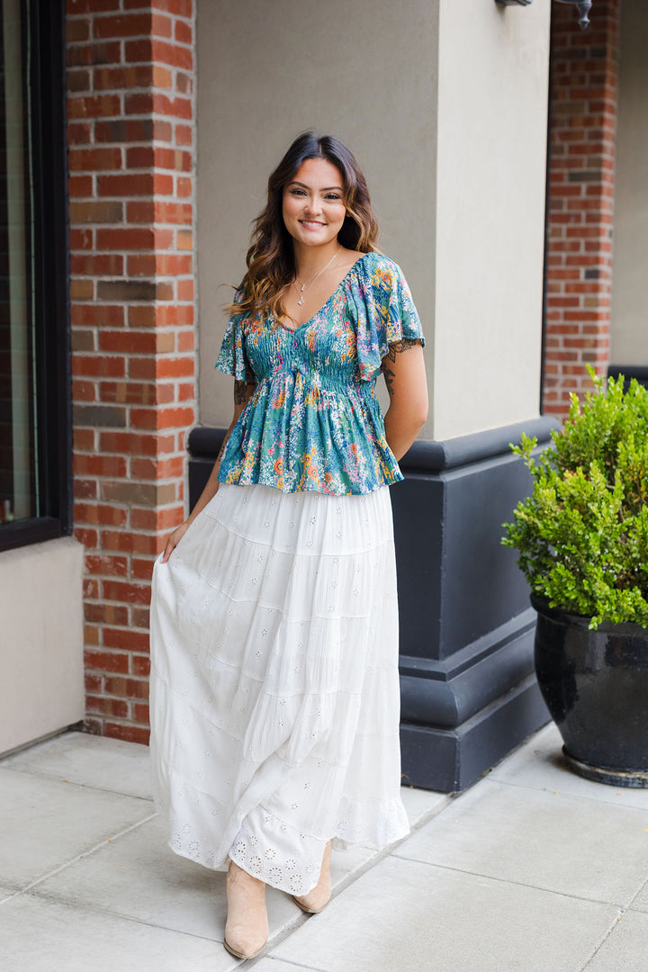 The Fleurs Truly Flutter Sleeve Top
