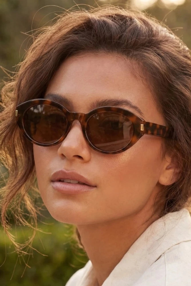 The Metallic Accent Oval Tortoise Sunglasses