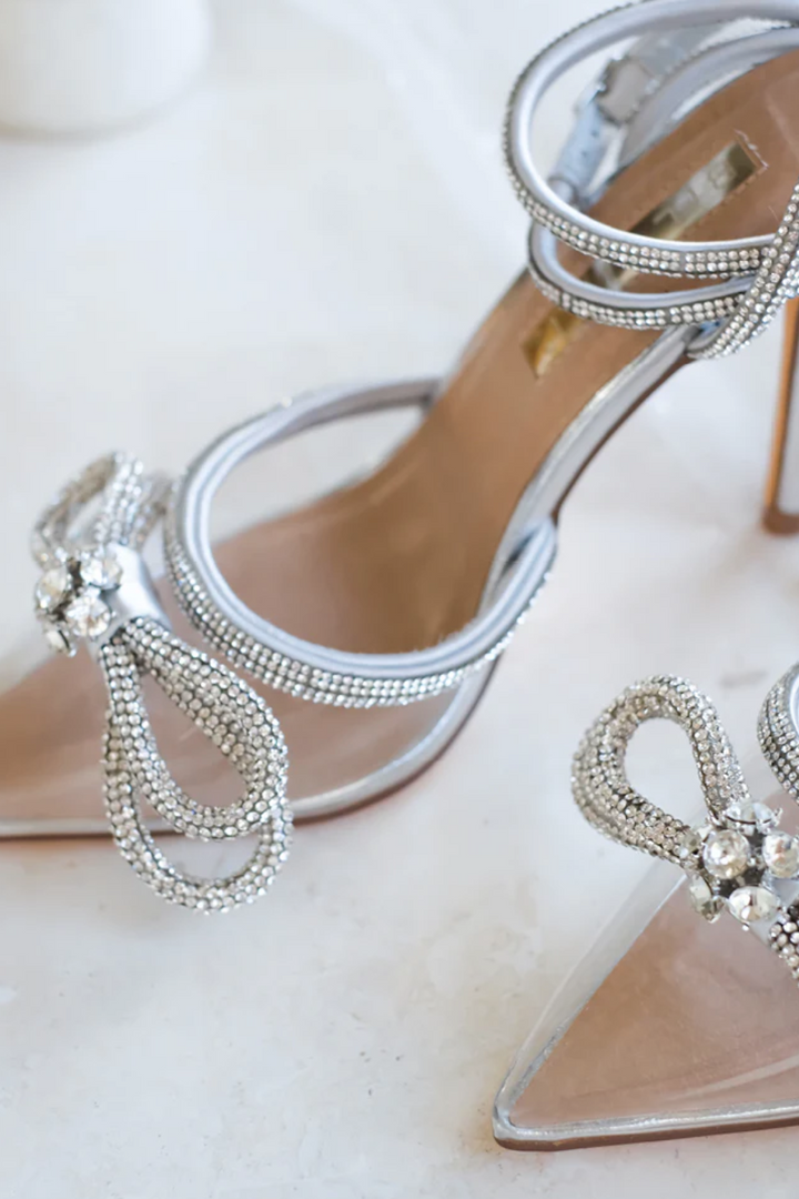 The Elope Clear & Silver Luxe Pointed Pumps by Bellini